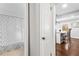 Bright bathroom featuring a shower with seashell-patterned curtain, tile floors, and neutral walls at 239 Lindbergh Ne Dr, Atlanta, GA 30305