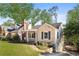 Inviting single-story home with a cozy front porch, complemented by lush landscaping and a well-manicured lawn at 239 Lindbergh Ne Dr, Atlanta, GA 30305