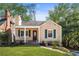 Charming exterior view of a home with a covered porch, swing, and attractive landscaping at 239 Lindbergh Ne Dr, Atlanta, GA 30305