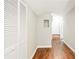 Hallway with hardwood floors, a louvered closet, and doorways to other parts of the home at 239 Lindbergh Ne Dr, Atlanta, GA 30305