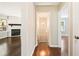 Hallway with hardwood floors with views of a staircase and living room with fireplace at 239 Lindbergh Ne Dr, Atlanta, GA 30305