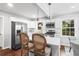 Eat-in kitchen with white cabinets, stainless steel appliances, and pendant lighting at 239 Lindbergh Ne Dr, Atlanta, GA 30305
