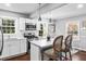 Modern kitchen with white cabinets, stainless steel appliances, and a stylish breakfast bar at 239 Lindbergh Ne Dr, Atlanta, GA 30305
