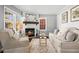 Bright living room featuring a fireplace, wood floors, and lots of natural light at 239 Lindbergh Ne Dr, Atlanta, GA 30305