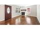 Living room with fireplace, wood floors, and lots of natural light at 239 Lindbergh Ne Dr, Atlanta, GA 30305