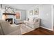 Cozy living room with a decorative fireplace, wood floors, and neutral color palette at 239 Lindbergh Ne Dr, Atlanta, GA 30305