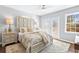 Bright main bedroom with a ceiling fan and access to a private deck at 239 Lindbergh Ne Dr, Atlanta, GA 30305