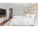 Nicely decorated main bedroom with a large television, ceiling fan, and closet access at 239 Lindbergh Ne Dr, Atlanta, GA 30305