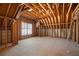 Unfinished attic space ready to be converted to a bedroom or recreation room, complete with a window at 407 Spring House Ne Cv, Atlanta, GA 30307