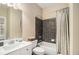 Well-maintained bathroom with a tub and shower combination, vanity, and neutral color scheme at 6350 Old Wood Hollow Way, Buford, GA 30518