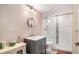 Nicely updated bathroom with sleek vanity, glass shower doors, and modern fixtures at 6350 Old Wood Hollow Way, Buford, GA 30518