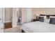 Comfortable bedroom featuring an ensuite bathroom, a plush bed, and neutral decor at 6350 Old Wood Hollow Way, Buford, GA 30518
