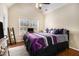 Comfortable bedroom with ample natural light and a spacious interior, ceiling fan, and computer desk at 6350 Old Wood Hollow Way, Buford, GA 30518