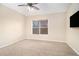 Spacious bedroom with plush carpeting and large window, perfect for relaxation at 6350 Old Wood Hollow Way, Buford, GA 30518
