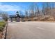 Well-maintained community entrance with covered drive through at 6350 Old Wood Hollow Way, Buford, GA 30518