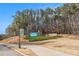 Lake Lanier Islands entrance sign with landscaping and mature trees at 6350 Old Wood Hollow Way, Buford, GA 30518