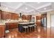 Gourmet kitchen with stainless steel appliances, granite countertops, and a large island for cooking and entertaining at 6350 Old Wood Hollow Way, Buford, GA 30518