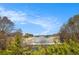 Scenic view from property overlooking a marina with boat slips on a sunny day at 6350 Old Wood Hollow Way, Buford, GA 30518