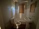 Compact bathroom features toilet, pedestal sink and bathtub/shower combination with tiled walls at 80 Harlan Sw Rd, Atlanta, GA 30311