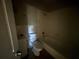 Dark bathroom with bathtub and toilet at 80 Harlan Sw Rd, Atlanta, GA 30311