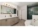 Beautiful bathroom featuring a soaking tub, glass-enclosed shower, and double vanity at 1059 Park Row North Se, Atlanta, GA 30312