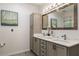 Bathroom featuring a double vanity with modern fixtures and ample storage space at 1059 Park Row North Se, Atlanta, GA 30312