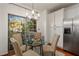 Eat-in breakfast nook featuring updated lighting and a stainless steel refrigerator at 1059 Park Row North Se, Atlanta, GA 30312