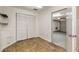 View of the hallway with closet and tiled flooring, leading to the garage at 1059 Park Row North Se, Atlanta, GA 30312