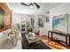 Inviting living room with hardwood floors, wood accent wall, and large windows, offering plenty of natural light at 1059 Park Row North Se, Atlanta, GA 30312