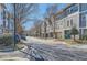 Street view of the townhome community featuring blue doors and lush landscaping at 1059 Park Row North Se, Atlanta, GA 30312