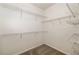 Spacious walk-in closet with ample shelving and carpeted flooring at 1059 Park Row North Se, Atlanta, GA 30312