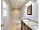 Bathroom features a sink with granite countertops and a shower-tub combo at 1294 Summit Chase Dr, Snellville, GA 30078