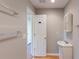 Bathroom featuring a vanity, chrome fixtures, wood floors, and a bright door frame at 1294 Summit Chase Dr, Snellville, GA 30078