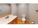 Bathroom featuring a sink with wood trim, a toilet, and grey walls at 1294 Summit Chase Dr, Snellville, GA 30078