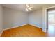 Cozy bedroom showcasing a ceiling fan and neutral walls, bathed in natural light at 1294 Summit Chase Dr, Snellville, GA 30078