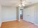 Bedroom featuring hardwood floors, ceiling fan, closet and doorway at 1294 Summit Chase Dr, Snellville, GA 30078