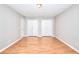 Bright room with neutral walls, wood floors, and double closets at 1294 Summit Chase Dr, Snellville, GA 30078