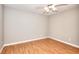 Clean bedroom with laminate floors, a ceiling fan, and neutral color palette at 1294 Summit Chase Dr, Snellville, GA 30078