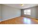 Bedroom with hardwood floors and a window offering natural light at 1294 Summit Chase Dr, Snellville, GA 30078