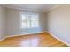 Bedroom features wood floors, neutral walls, and bright natural light from a window at 1294 Summit Chase Dr, Snellville, GA 30078