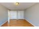 Bright room with neutral walls, wood floors, and double closets at 1294 Summit Chase Dr, Snellville, GA 30078