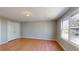 Bright room with neutral walls, wood floors, and a window at 1294 Summit Chase Dr, Snellville, GA 30078