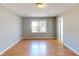 Bright room with neutral walls, wood floors, and a window at 1294 Summit Chase Dr, Snellville, GA 30078