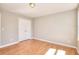 Neutral bedroom with laminate floors and a double-door closet providing ample storage space at 1294 Summit Chase Dr, Snellville, GA 30078