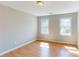 Bedroom with hardwood floors and two windows providing natural light at 1294 Summit Chase Dr, Snellville, GA 30078