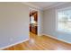 Dining room features wood floors, neutral walls, natural light, and kitchen view at 1294 Summit Chase Dr, Snellville, GA 30078