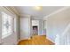 Well-lit foyer with hardwood floors and decorative glass front door, showing access to living area at 1294 Summit Chase Dr, Snellville, GA 30078