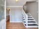 Bright foyer with hardwood floors and a staircase, leading to the upper level of the home at 1294 Summit Chase Dr, Snellville, GA 30078