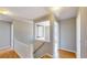 Upstairs hallway area showing neutral paint and hardwood floors at 1294 Summit Chase Dr, Snellville, GA 30078