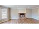 Living room with fireplace, hardwood flooring, and natural light at 1294 Summit Chase Dr, Snellville, GA 30078